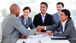 Multi-ethnic business people greeting each other